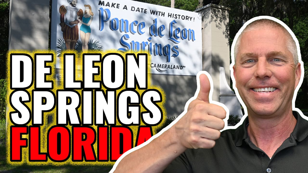 text De Leon Springs Florida in front of old sign for the springs, Chuck giving thumbs up