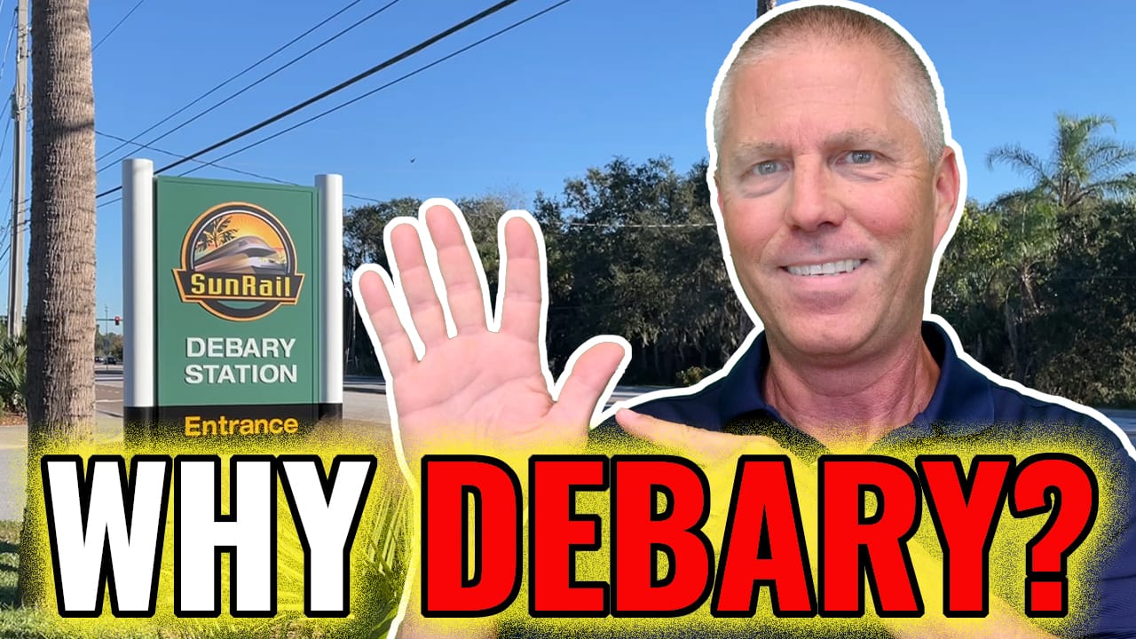 Chuck holding up 5 fingers in front of DeBary Sunrail station